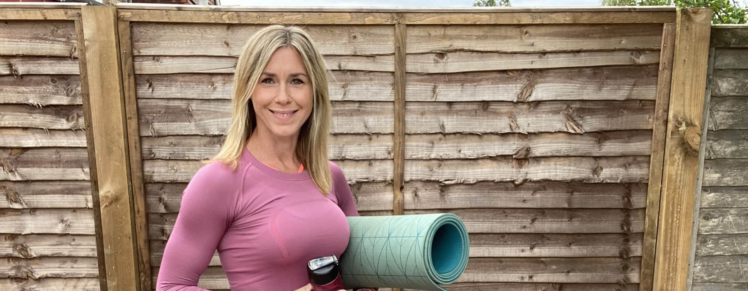 Lucinda Holding Yoga Mat and Drink
